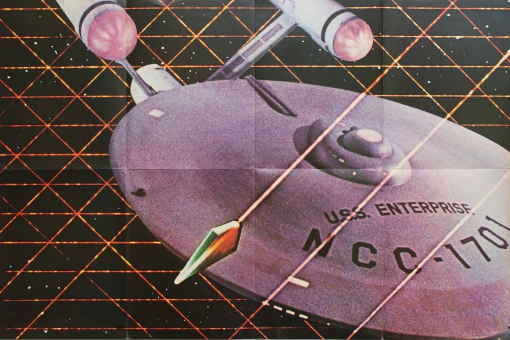 Big poster of the USS Enterprise being cocooned by Tholian ships in the first issue of the Star Trek Giant Poster Book.