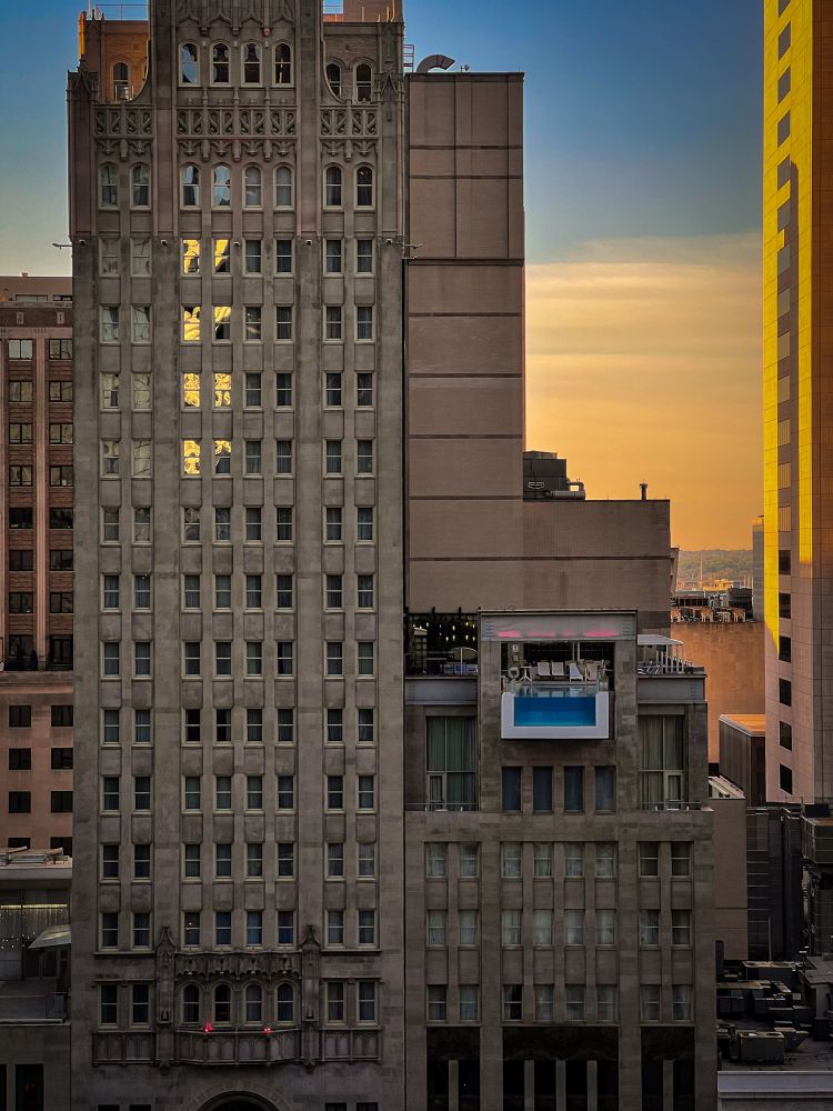 Subset view of a Dallas hotel with an upper lever pool extending over the street. 