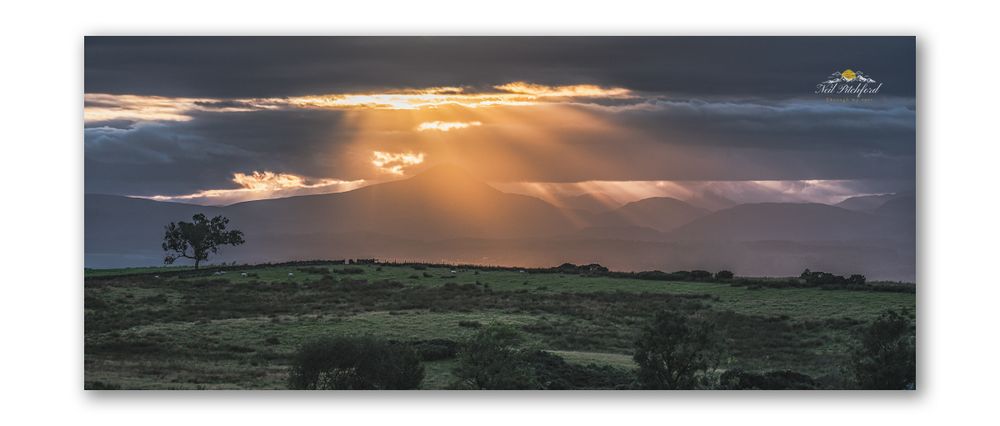 A break in the clouds over the Trossachs, Scotland.