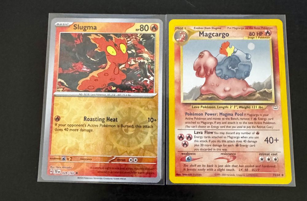The Slugma is a duplicate but I wanted another card and it was buy 4 get one free and they didn't have much I wanted, the Magcargo - those eyes! 