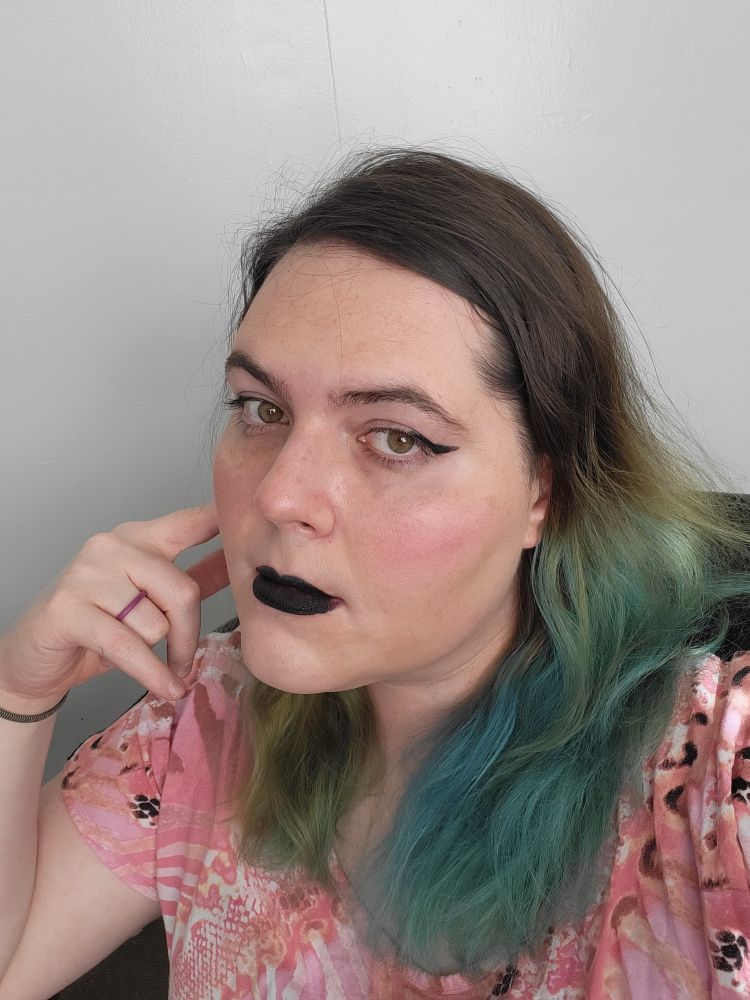 Me with a bored look while waiting for work to end.