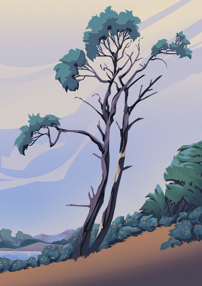 two trees in front of a row of bushes with some lake and mountains in the background