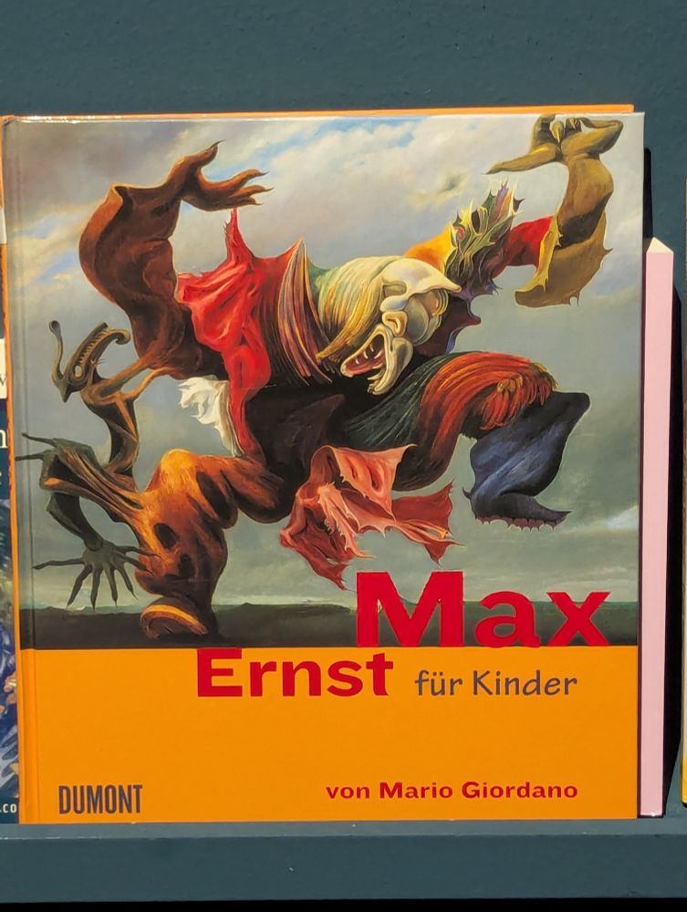 The cover of Max Ernst für Kinder. The painting Der Engel Des Herdes, depicting a large beaked figure composed of various colourful forms, is on the cover.
