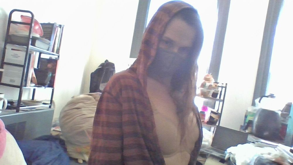 Trying to fake looking confident while posting with my hoodie open, no shirt on underneath and my hair covering my face