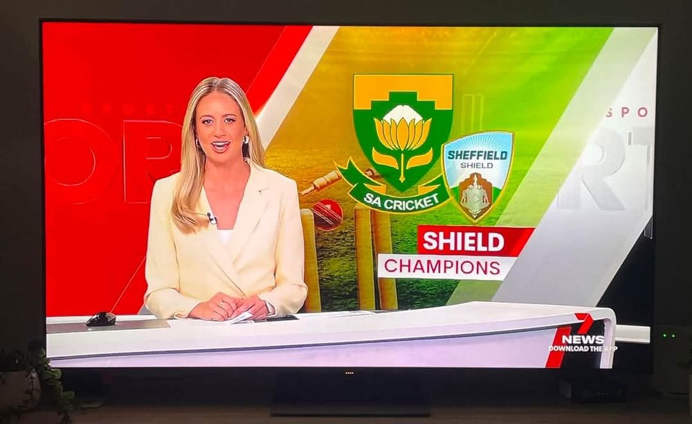 News reader with the South African logo behind her, instead of South Australia, while reporting on the winners of the Sheffield Shield.