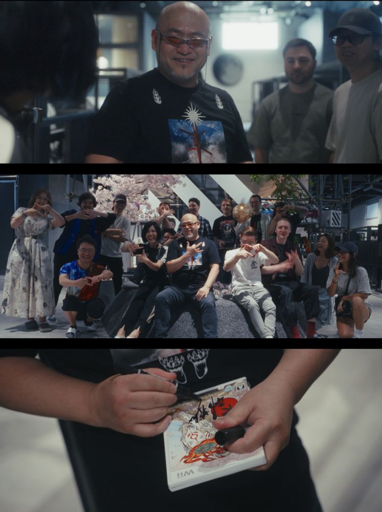 Hideki Kamiya at UNSEEN studio with team members signing Okami game. 