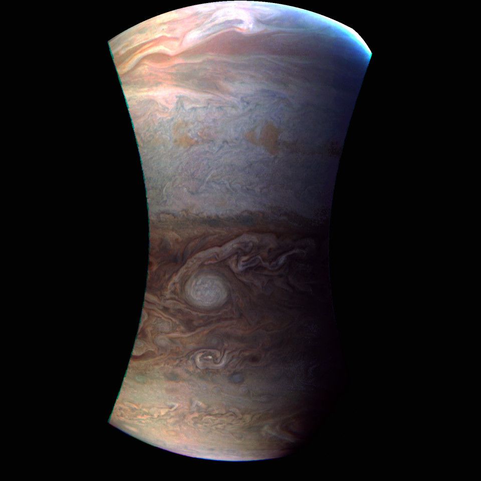 Close-up view of Jupiter containing just a few of its cloud bands, with a bright circular storm and the turbulence around it being particularly prominent.