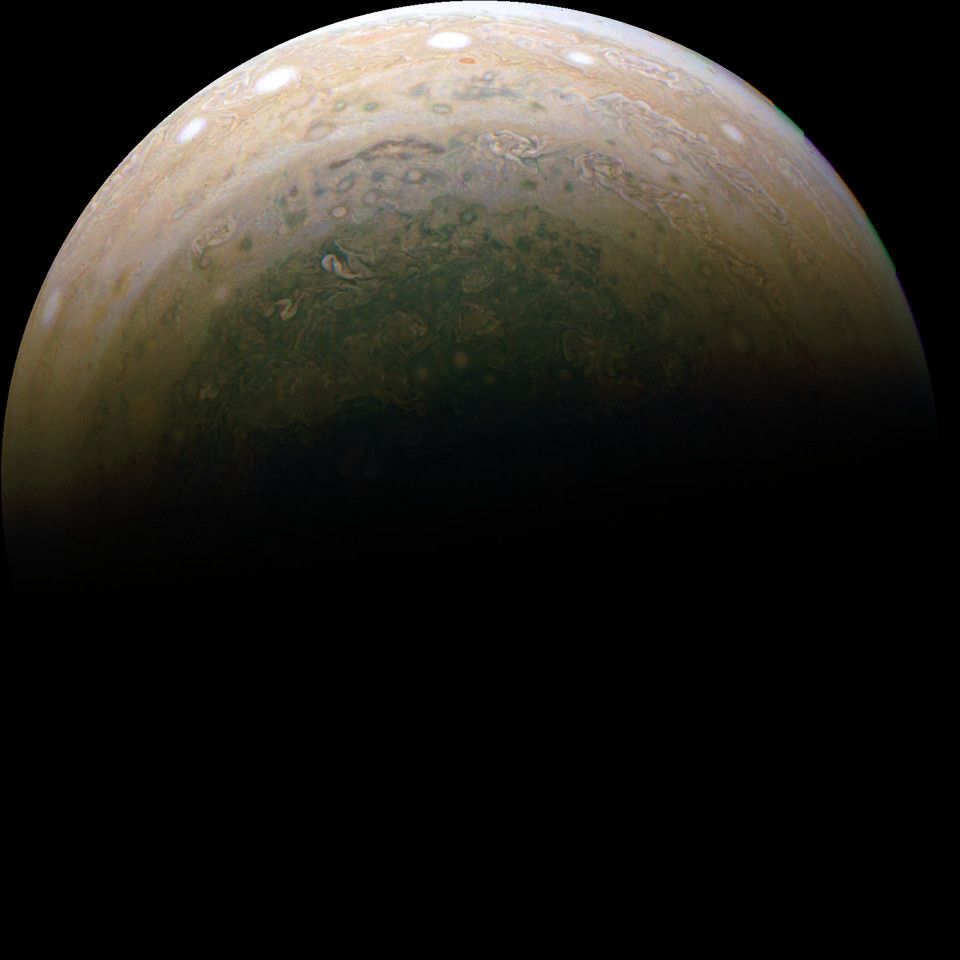 View of Jupiter's southernmost latitudes, centred near the pole. Storms can be seen through the various cloud bands surrounding the polar hood.