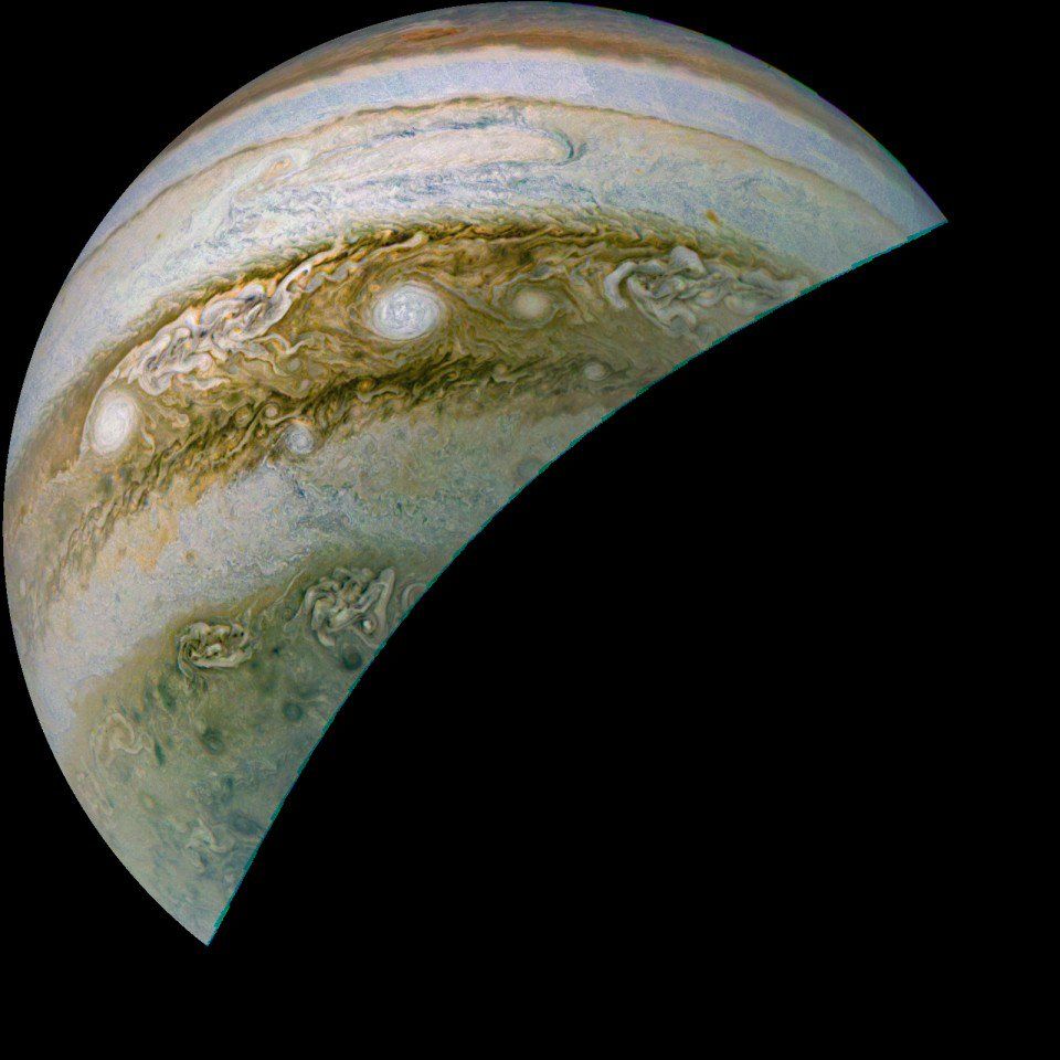 Photo of Jupiter's southern hemisphere, showing a few of the planet's cloud bands. Two bright oval storms are prominent near the centre of the field of view, with countless other turbulent storm systems present throughout the cloudtops.