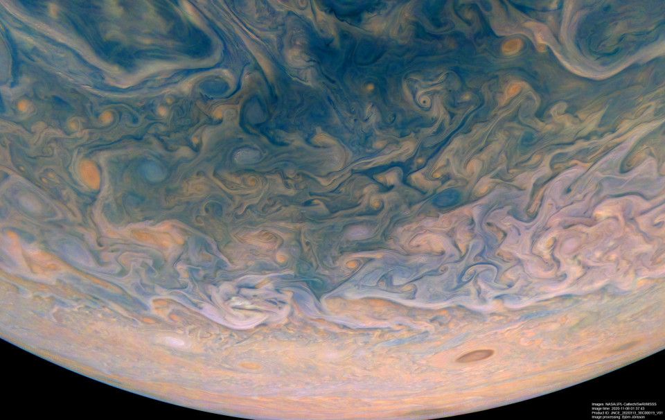 Picture of Jupiter's northern high latitudes, displaying the turbulence present in the area between the planet's polar hood and its northernmost cloud band.