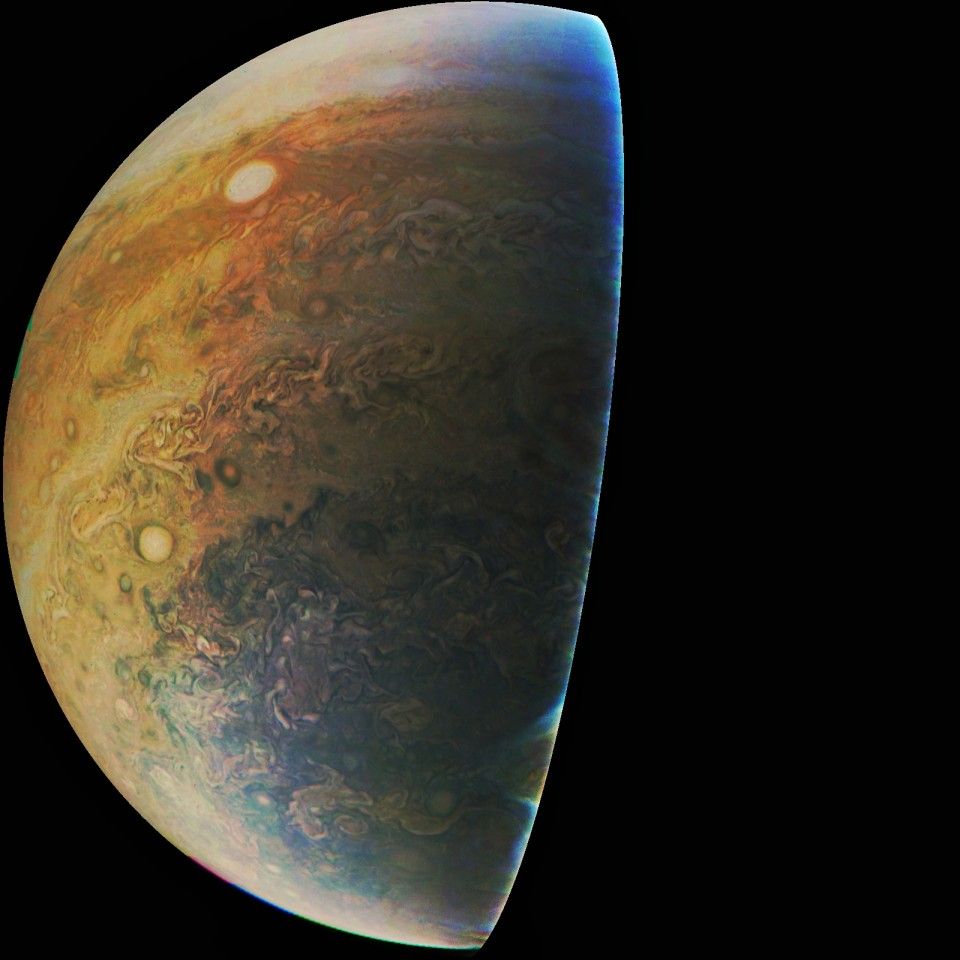 Southern view of the planet Jupiter, showing part of its polar hood region and the various cloud bands around it.
