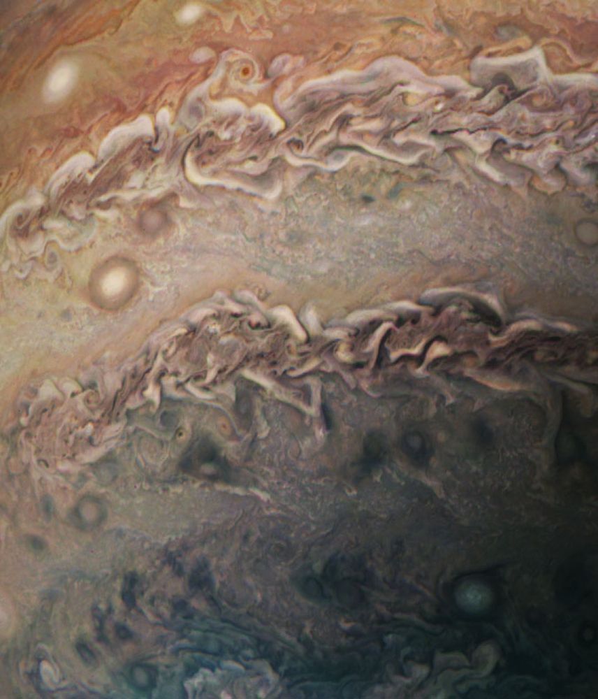 Close-up view of Jupiter's cloudtops, displaying a few extremely turbulent storm systems.