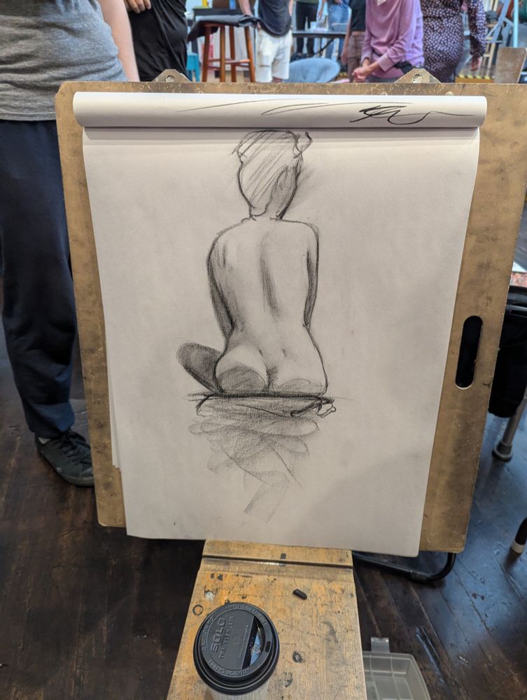 Rough sketch of woman sitting facing away from viewer. Legs and arms not visible.

15 minute figure drawing pose in charcoal