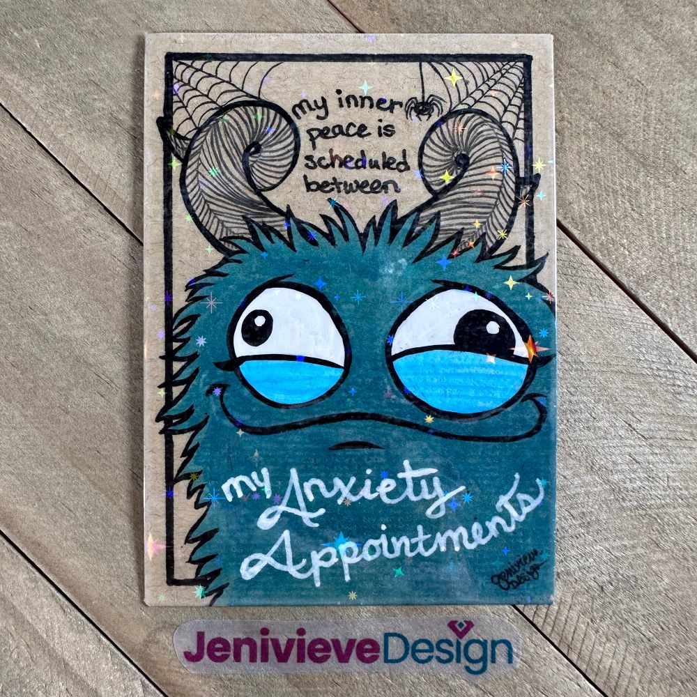 Illustration of a fluff monster using alcohol markers, brush pen, graphite, acrylic paint, and gel pen on brown cardstock. By Jenivieve Design.