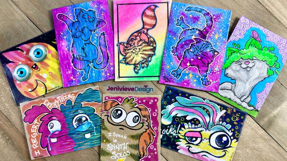 A sampling of Jenivieve Design's 2.5" x 3.5" art card designs, including cats and fluff monsters. Watercolors, gel pens, alcohol markers, brush pen.