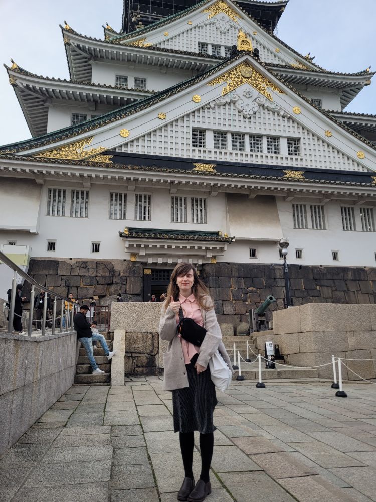 Me in front of Osaka Castle. Doing a thumbs up.