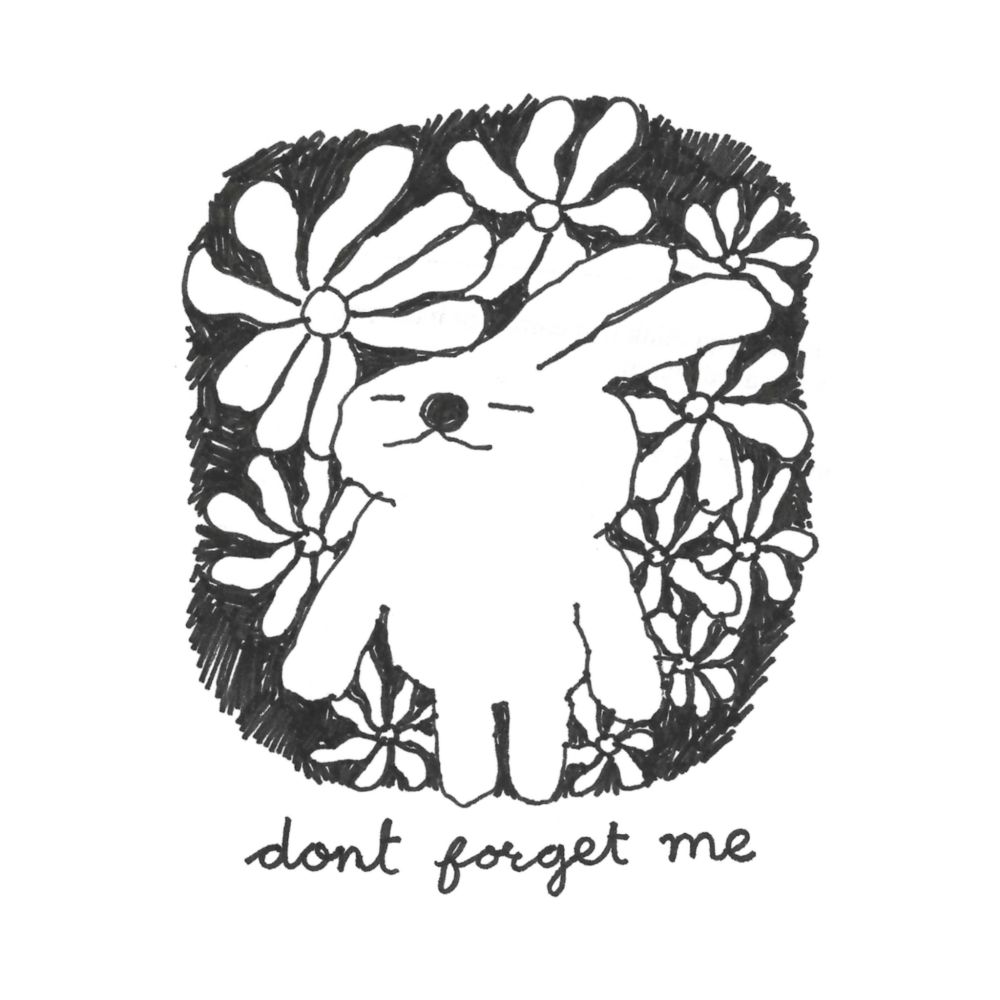A bunny, standing with several flowers, closes its eyes and tilts back its head. Text reads: "don't forget me".