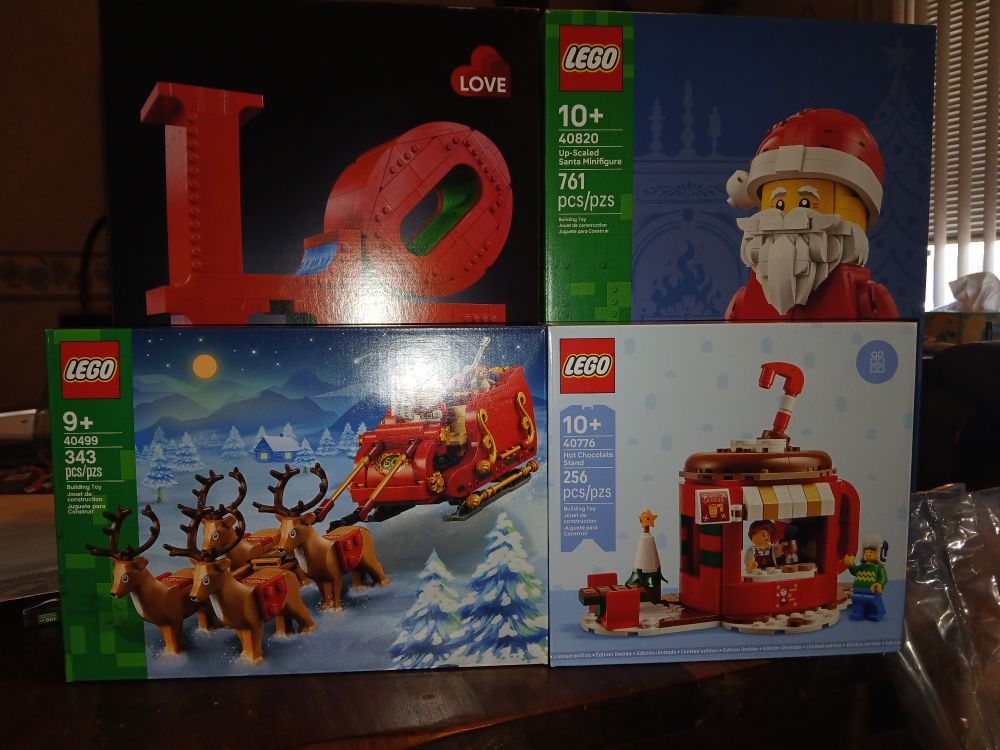 A picture of 4 Lego sets, 3 are Christmas themed and 1 is the "LOVE"  art installation. I also picked up a Lego Minifigure Black Panther keychain (not pictured).
