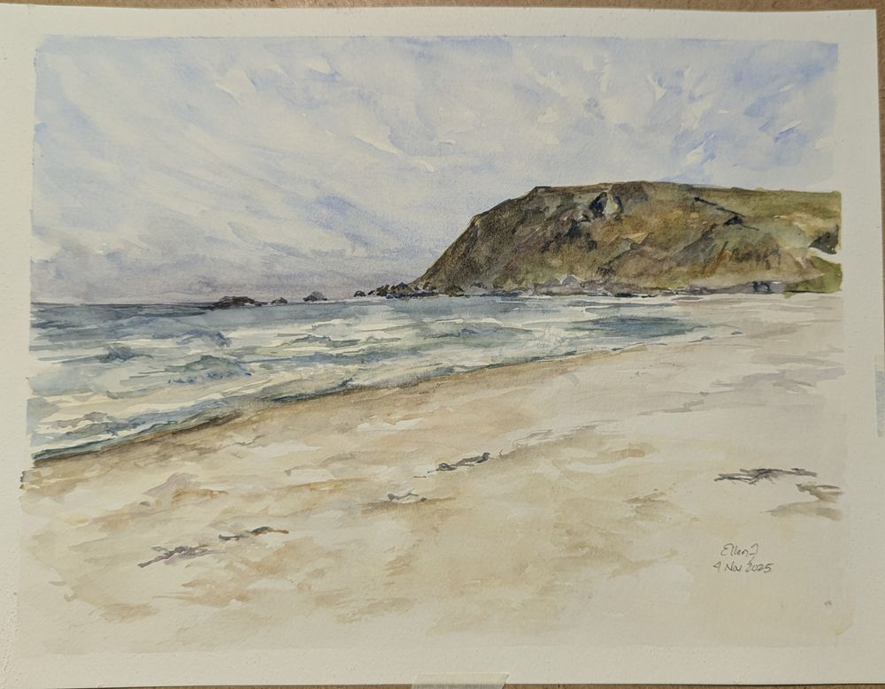 Watercolor painting of blue green ocean with white caps, light sandy beach, and a distant greenish brown Hill on the right. Painting by Ellen Friedman
