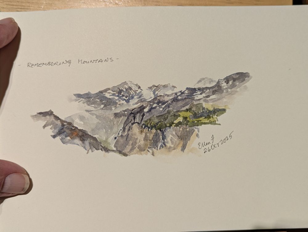 Quick sketch in watercolors of distant mountain peaks beyond a valley. Painting by Ellen Friedman
