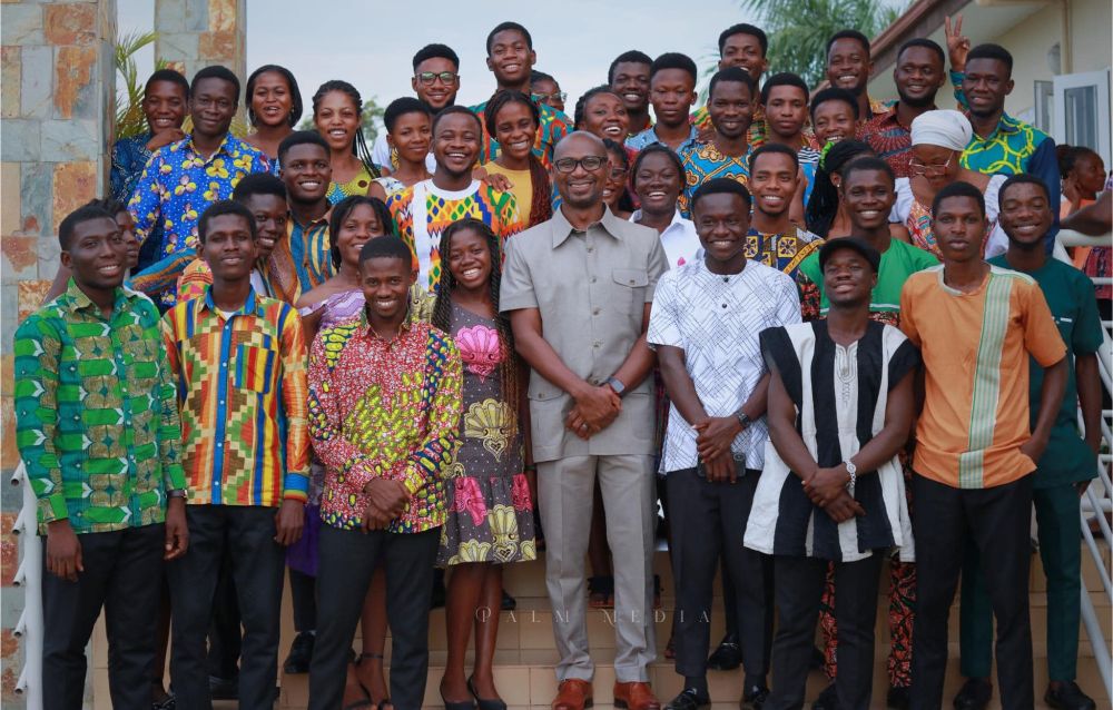 Palm University Founder & President Peter Okantey, surrounded by Palm students who will change the future of Ghana.