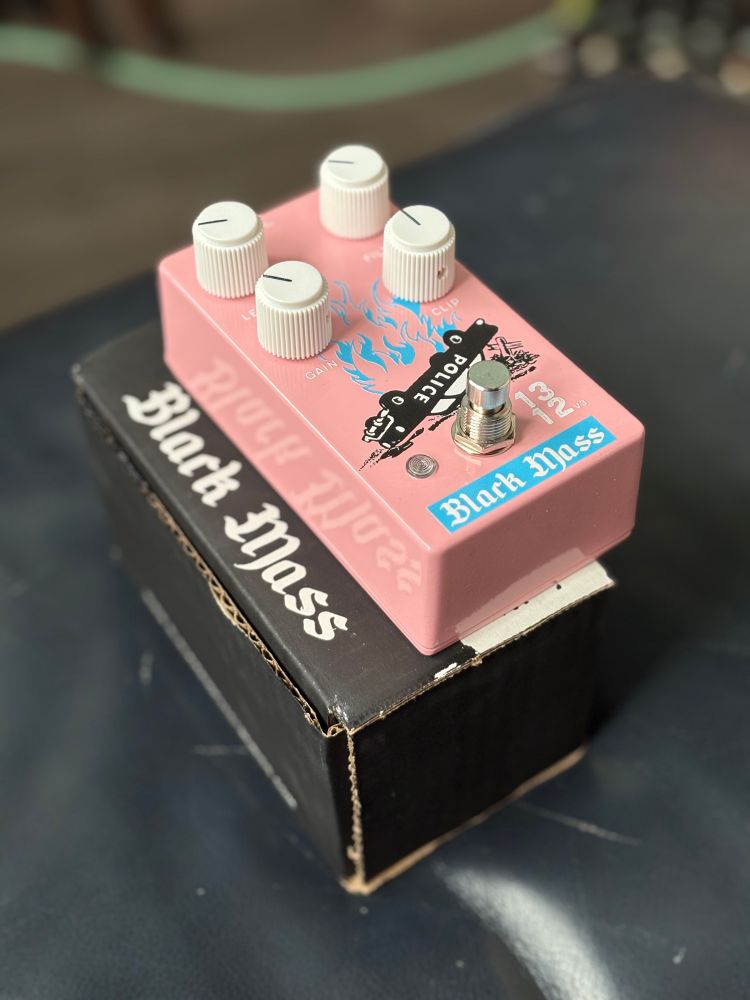 1312 pedal from Black Mass Electronics featuring the pink and teal colors with 1312 and an upside down cop car burning printed on the pedal. 