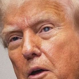 A picture of Donald Trump showing some weirdness in his left eye. Cataracts? Odd reflection? Is he a replicant?