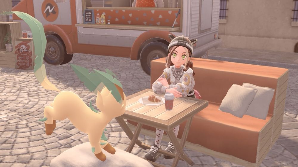 Rosie with leafeon at cafe with coffee and crossaint in Pokemon ZA