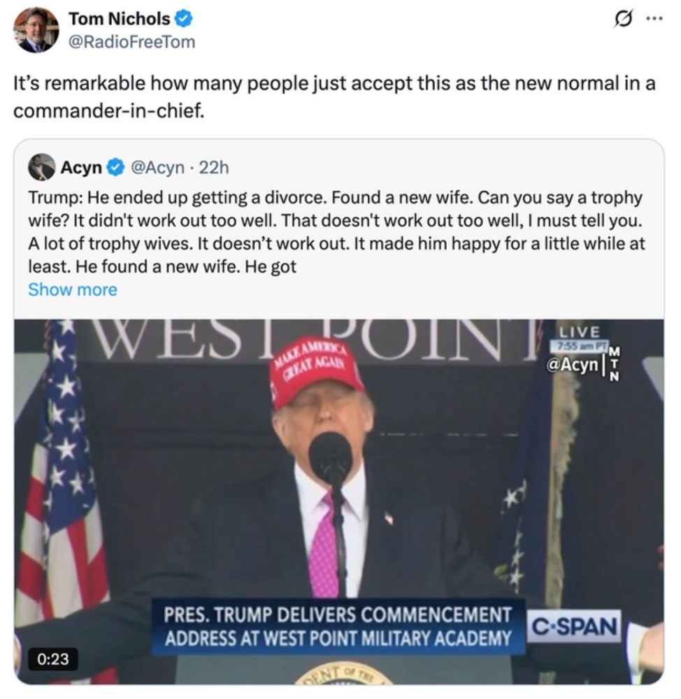 Image features Shuffles The Clown delivering a commencement address at West Point Military Academy, wearing a MAGA hat. The image includes a tweet from Tom Nichols commenting on the speech and a quote from Acyn which reads
