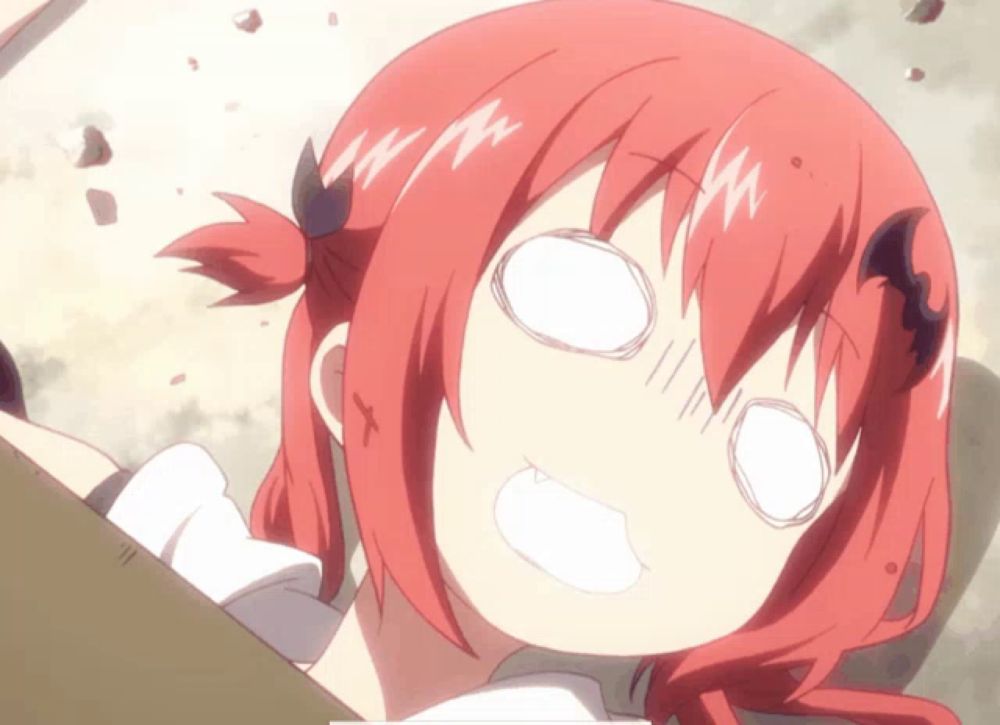 a girl with red hair and horns making a funny face