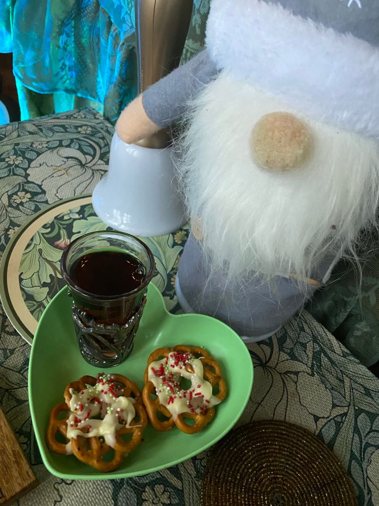 A small sherry and Christmas wreath pretzels sit out for Santa.
