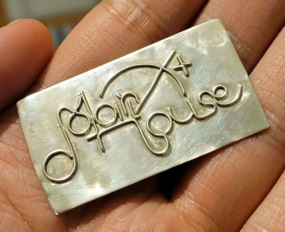 Silver plate with the full Solar House logo