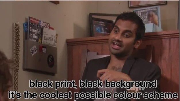 Still from Parks and Recreation. Tom Haverford (Aziz Ansari), in reference to his unreadable business card, saying, “Black print, black background. It’s the coolest possible color scheme.”