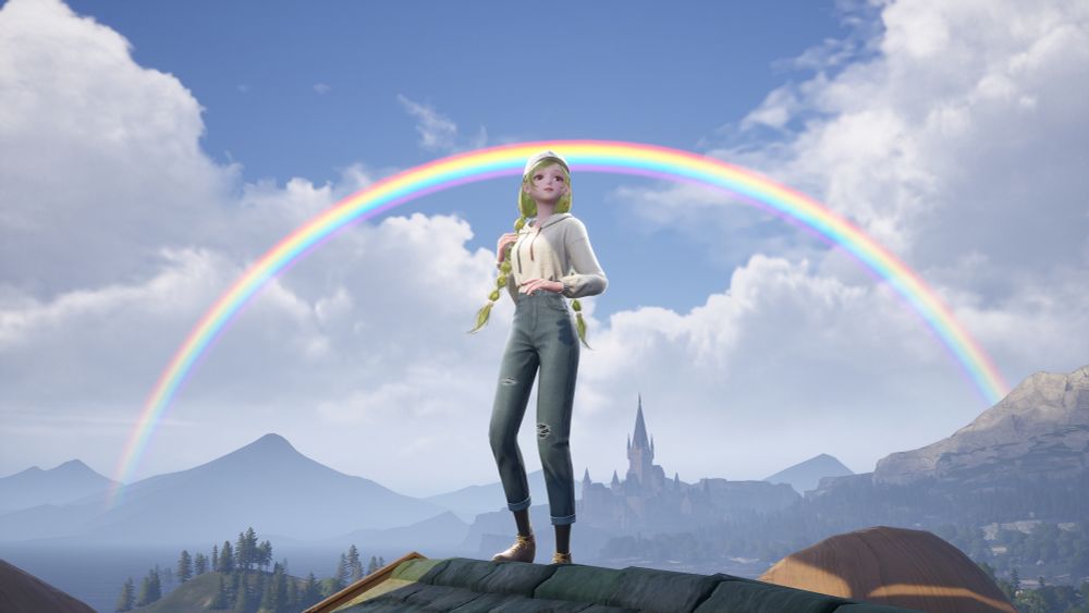 Nikki on a rooftop with a rainbow behind her