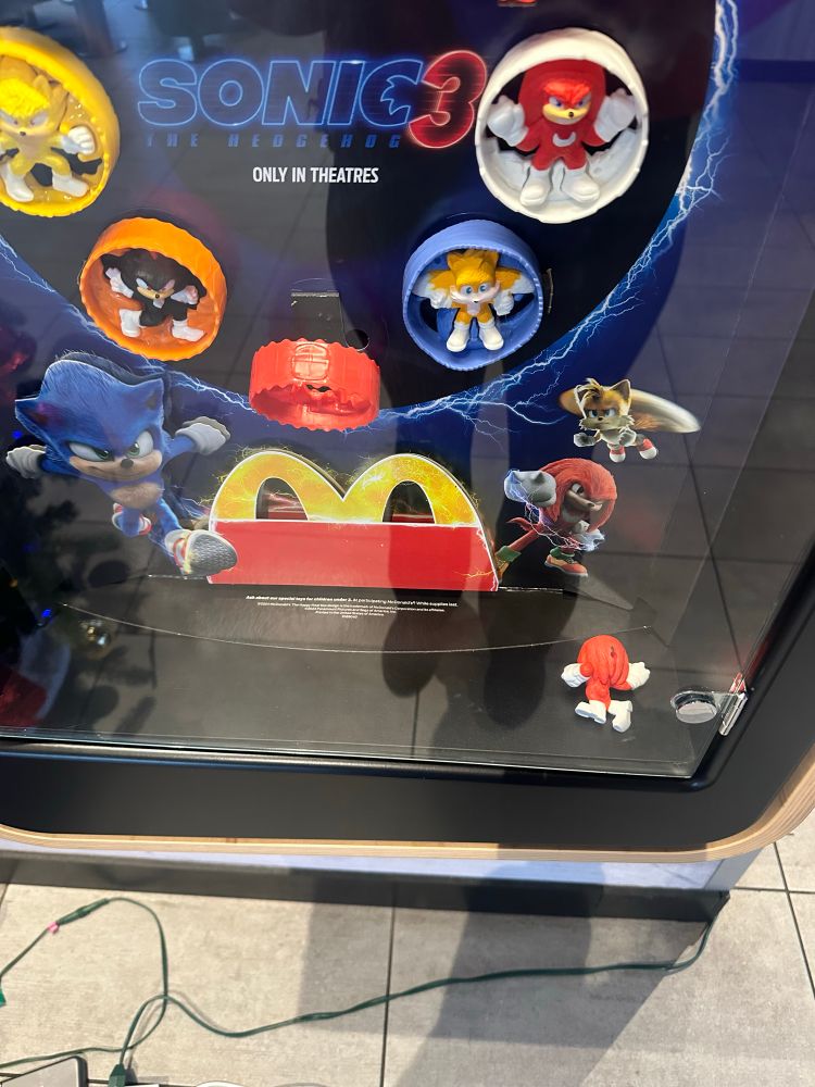 A toy Knuckles from the Sonic franchise faced down in a McDonald’s toy display