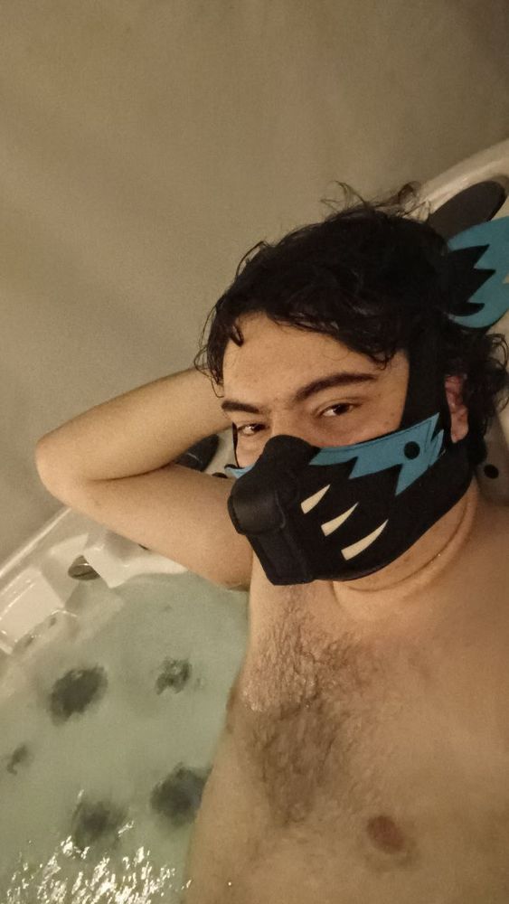 Divik in a hot tub and blue K-wolf partial hood