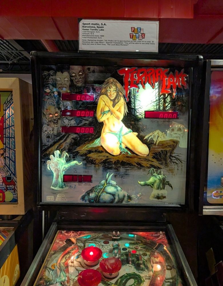 Terrific Lake backglass.  Woman in torn clothes being attacked by swamp monsters