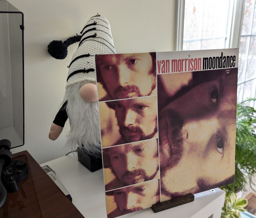 A photo of the vinyl cover of Van Morrison's "Moondance". With a Christmas gnome in the background.