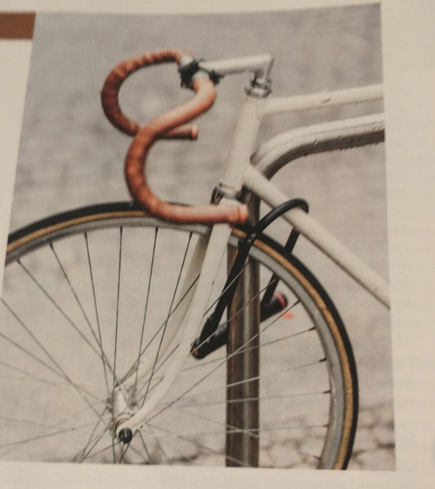 Bicycle locked to stand.
