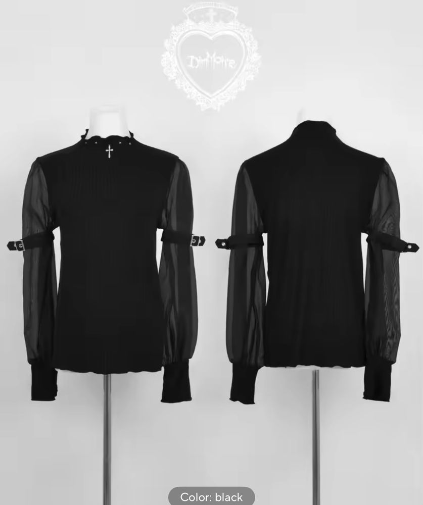 aliexpress dupe(?) of a black dimmoire blouse with long sheer sleeves and a christian cross embellishment on the collar