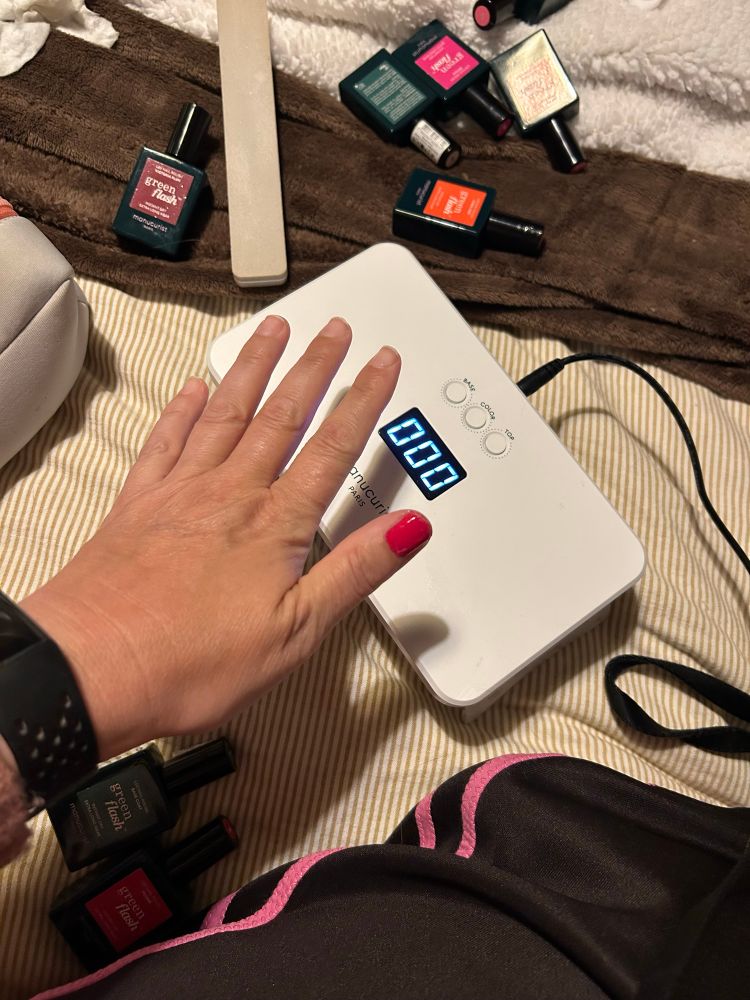 Manicure set with one nail painted red 