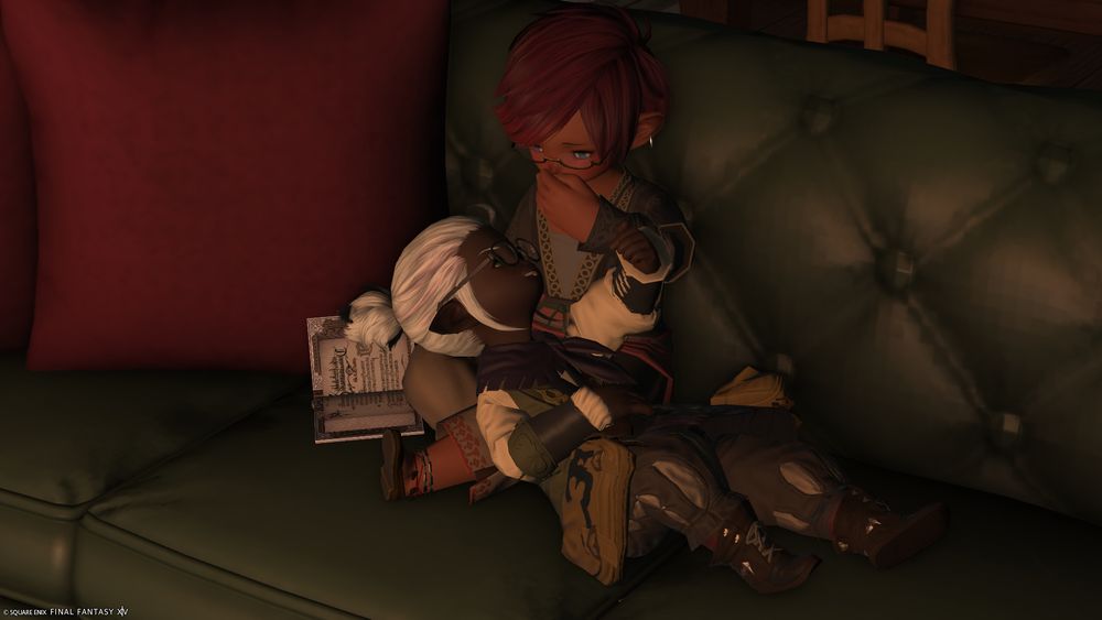 Screenshot of Reliq and Nananji lying together on the couch in their cozy apartment.  Having realized that he got a little too caught up in the Nanaji toying with him.  In embarrassment, Reliq covers his mouth that let out the traitorous moan.  Nanaji is grinning with satisfaction that he's gotten such a cute reaction out of Reliq, who is usually the one who teasing him.