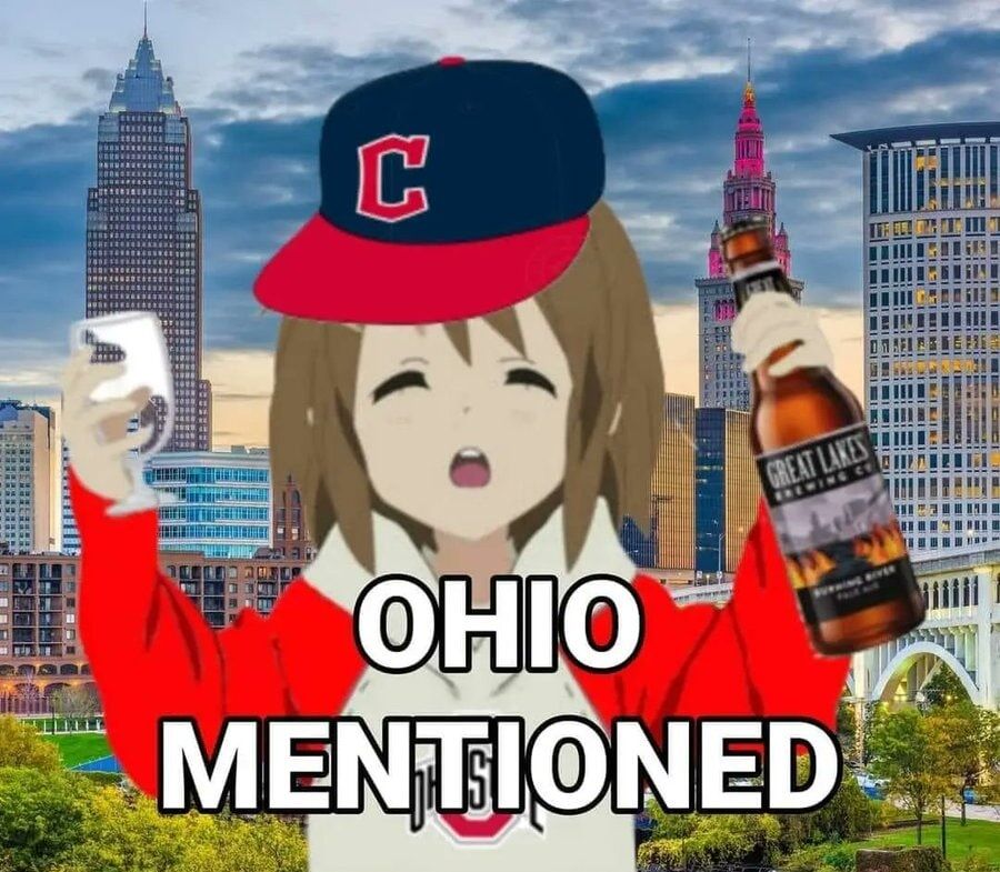 a picture depicting yui from K-On wearing a guardians baseball cap, wearing an ohio state hoodie, drinking greate lakes brewing company beer with a backdrop of the cleveland skyline