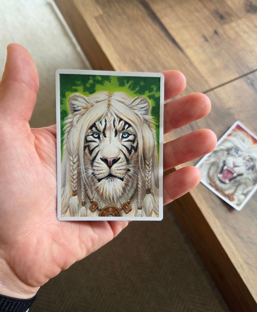 Acrylic painting of Ajani, Nacatl Pariah from Magic the Gathering painted on an artist proof (a white-backed MtG card).