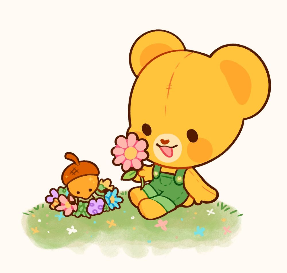 Yellow plush bear in green overalls sits on a flower-filled green hill while holding a pink flower. A little golden acorn with eyes, arms, and legs, who is making. flower crown.