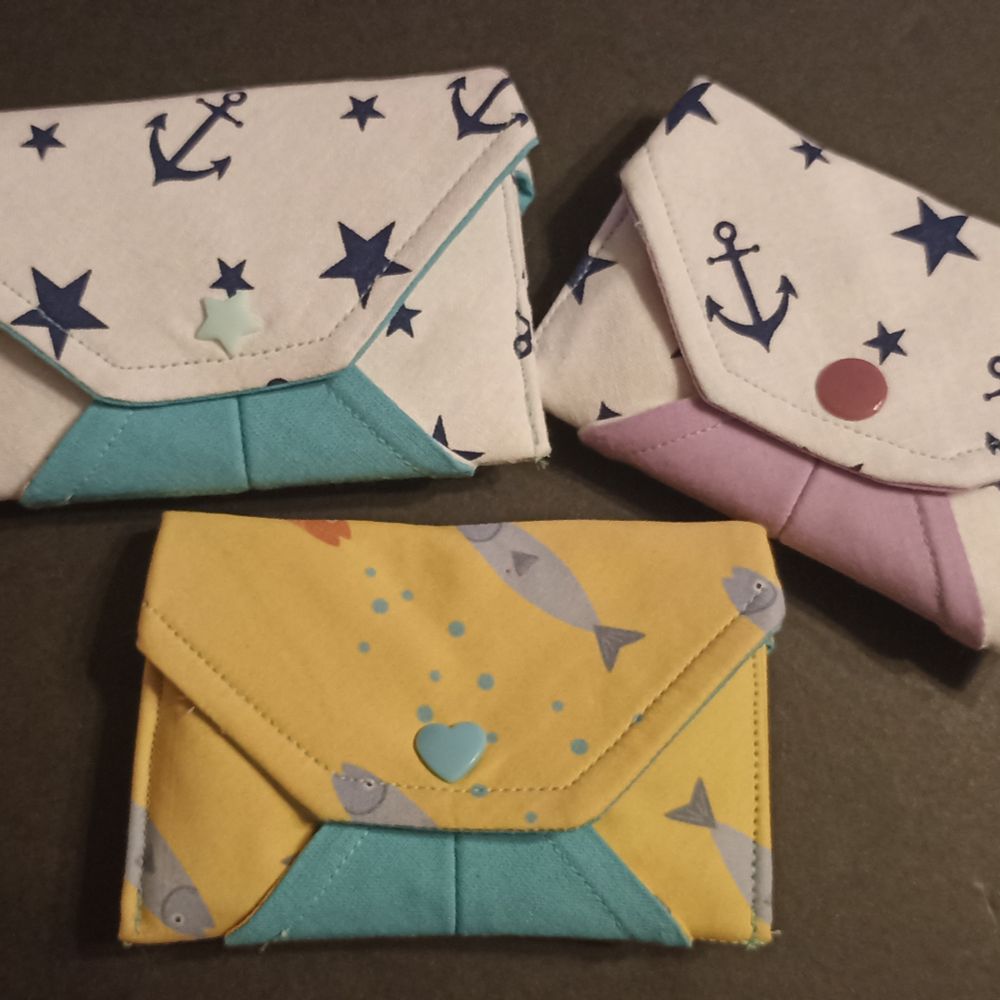 Three little envelope pouches handmade by me.