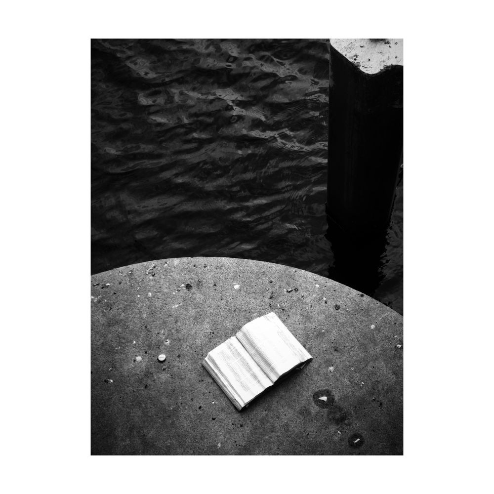 Book on a stone near the river