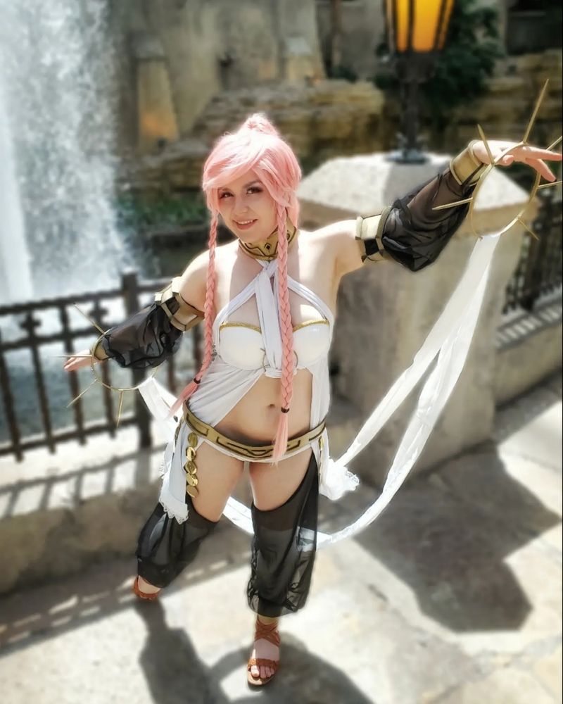 Image of me cosplaying Olivia from Fire Emblem Awakening on a stone bridge in front of a fountain