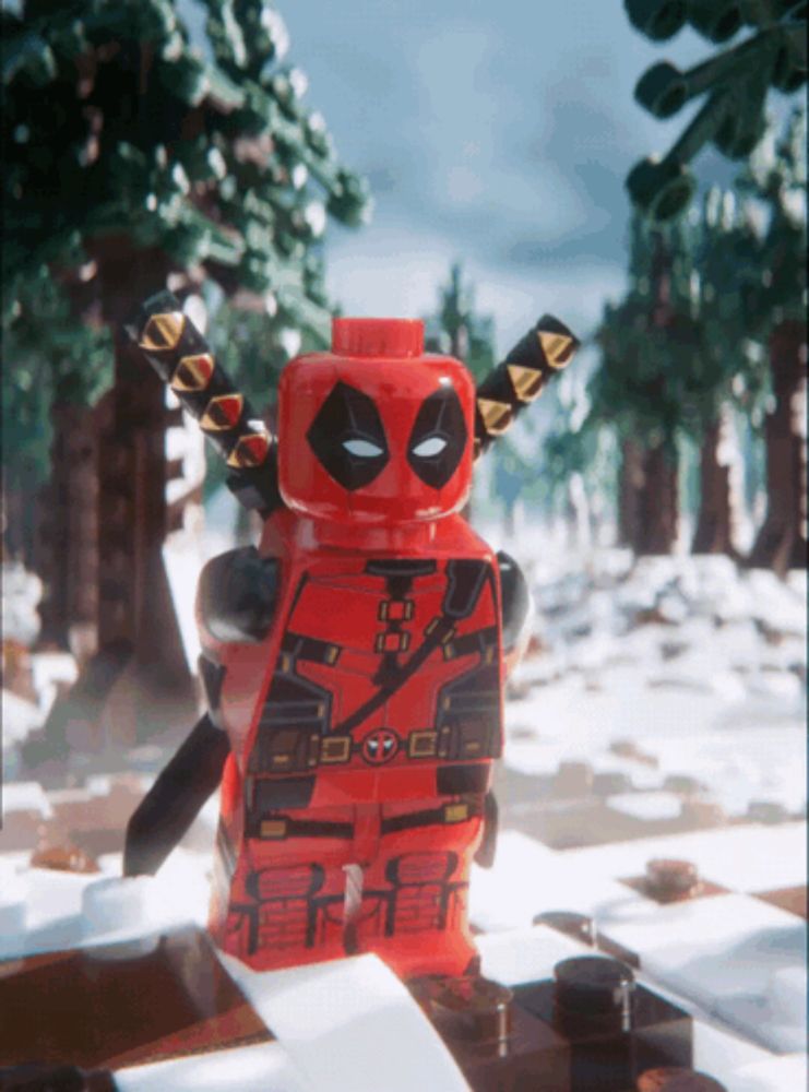 a lego deadpool figure stands in the snow