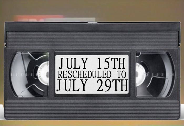 Big VHS tape reading "JULY 15TH RESCHEDULED TO JULY 29TH," which itself is pasted over a still frame of a BASF commercial. (This still frame, as it happens, was too much of a pain in the ass to Photoshop to look like it was saying "JULY 15TH RESCHEDULED TO JULY 29TH" naturally. One can only imagine how it ended up here, of all places!)